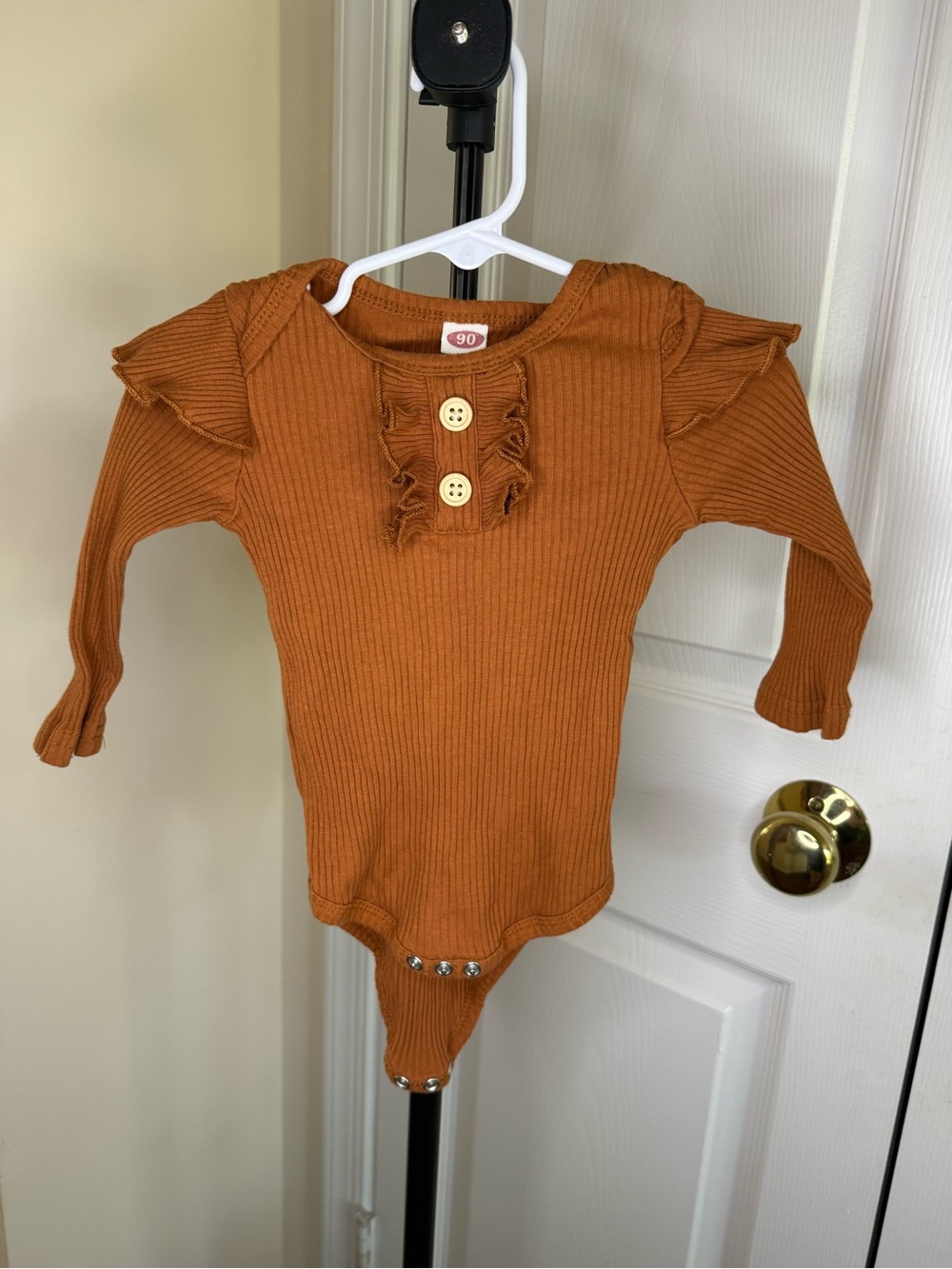 Rust Ribbed Long-Sleeve One-Piece with Ruffle Accents